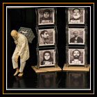 بخش عکس فیچر و زندگی روزمره / نفر سوم / یک بازیگر در حال اجرای نمایش در کنار عکس زندانیان سیاسی قبل از انقلاب / بهروز مهری - خبرگزاری فرانسه 